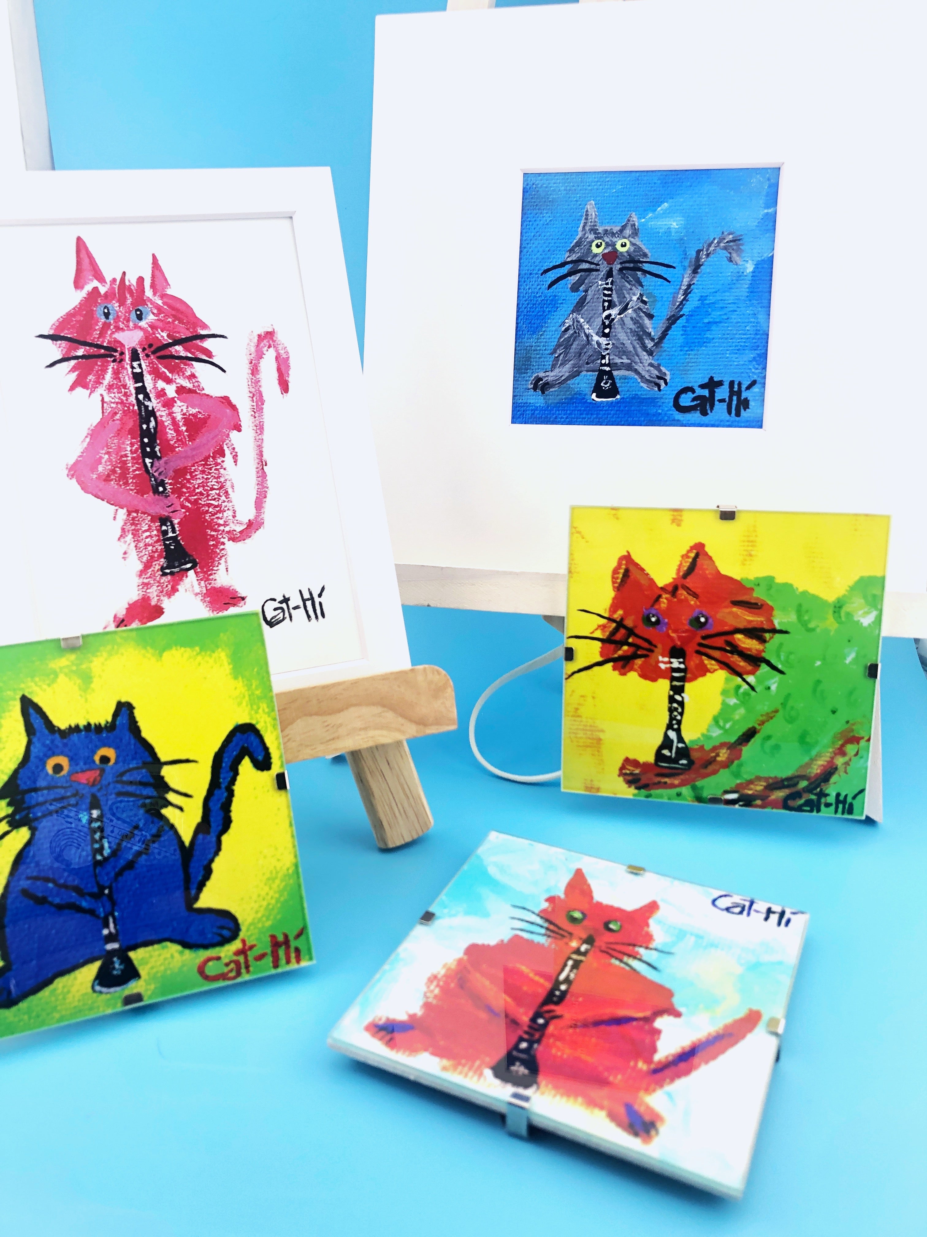 Collection of colorful cat paintings on a blue background